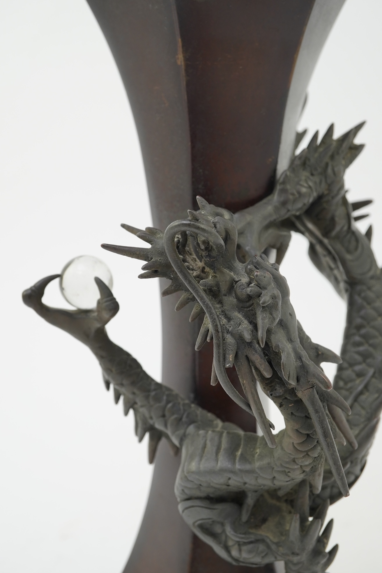 A Japanese bronze 'dragon' hexagonal beaker vase, Meiji period